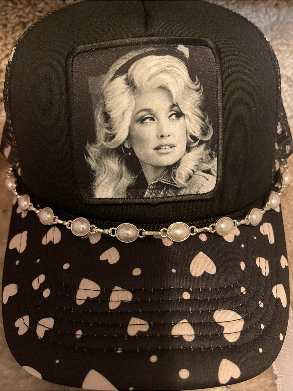 Dolly Black Heart-Print Trucker Hat with Pearl Chain and Icon Patch